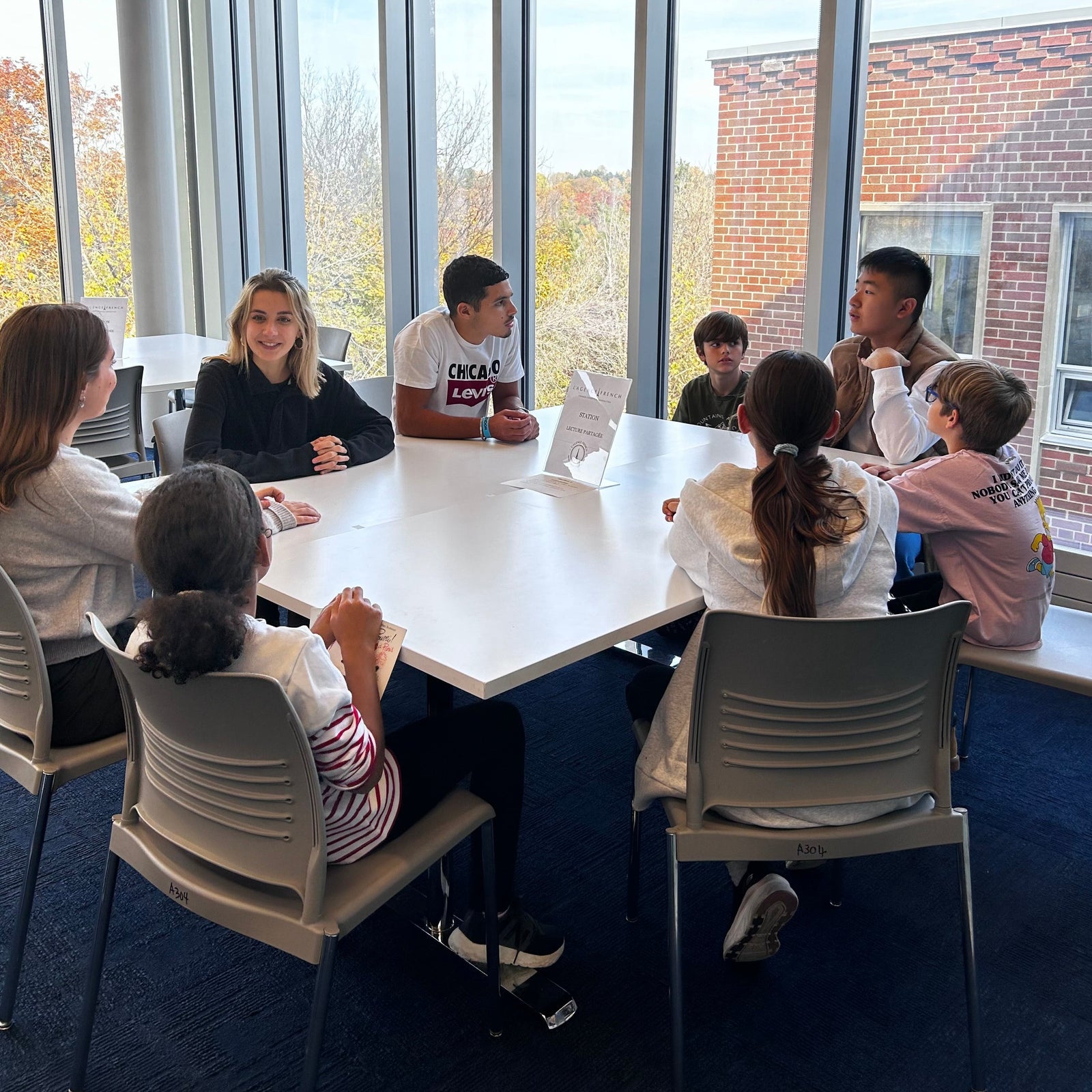 Students working together at L'Agence French