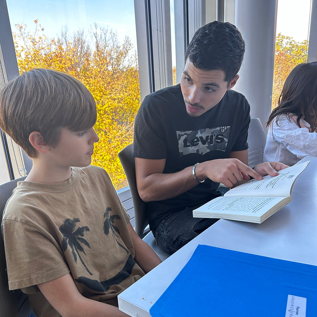 male french tutor with student at L'Agence French